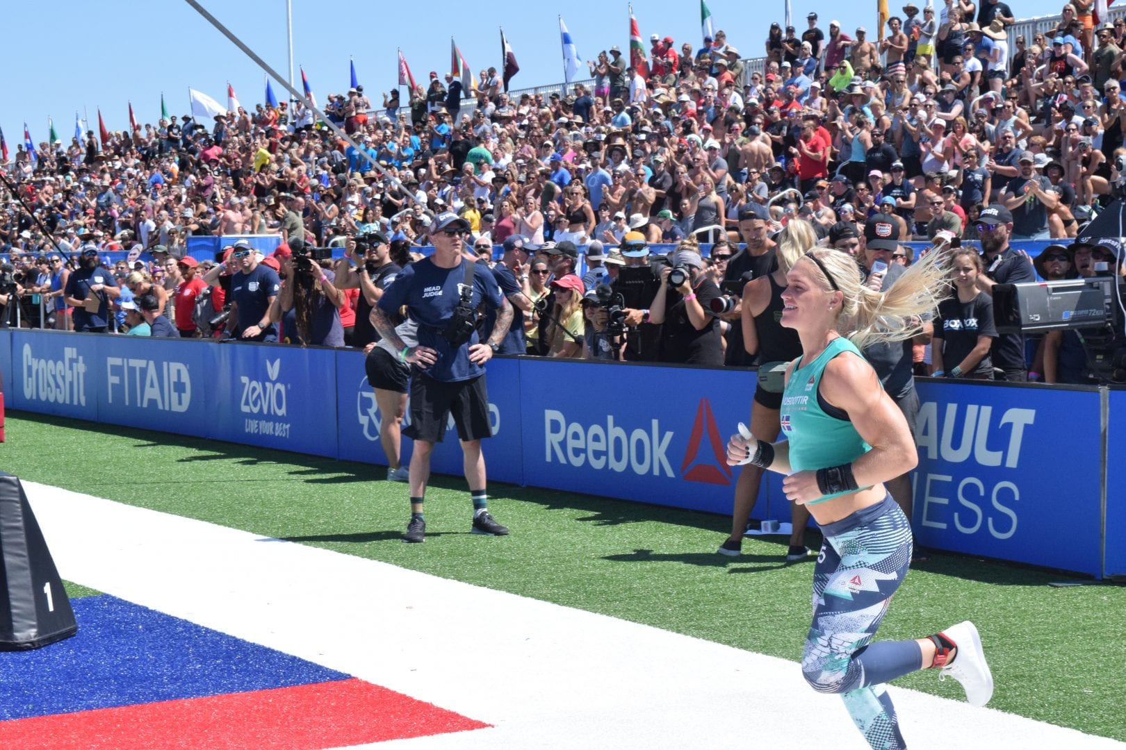 Katrin Davidsdottir jogs onto the field on the first day of the 2019 CrossFit Games