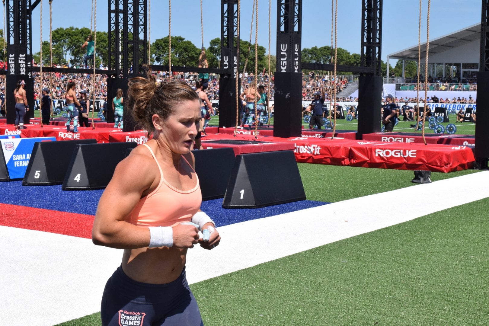Tia-Clair Toomey completes a run between sets of legless rope climbs at the 2019 CrossFit Games
