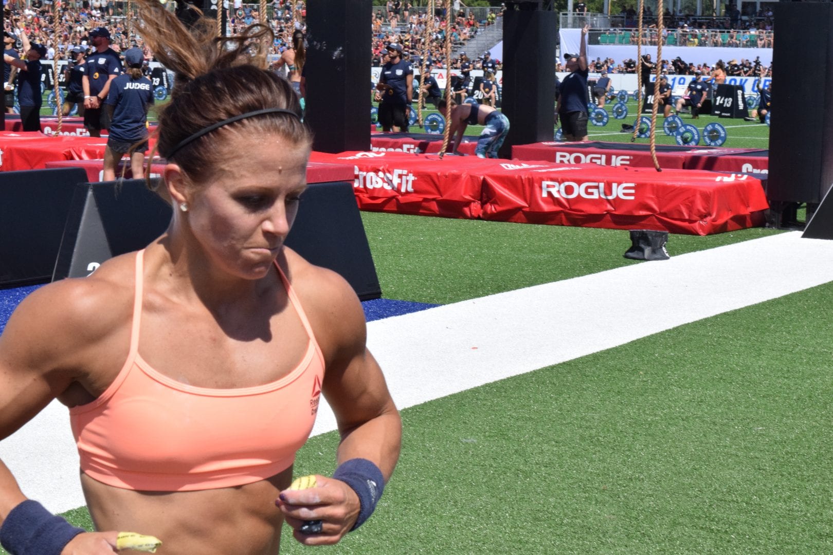 Kriston Holte takes a lap between rounds of legless rope climbs at the 2019 CrossFit Games