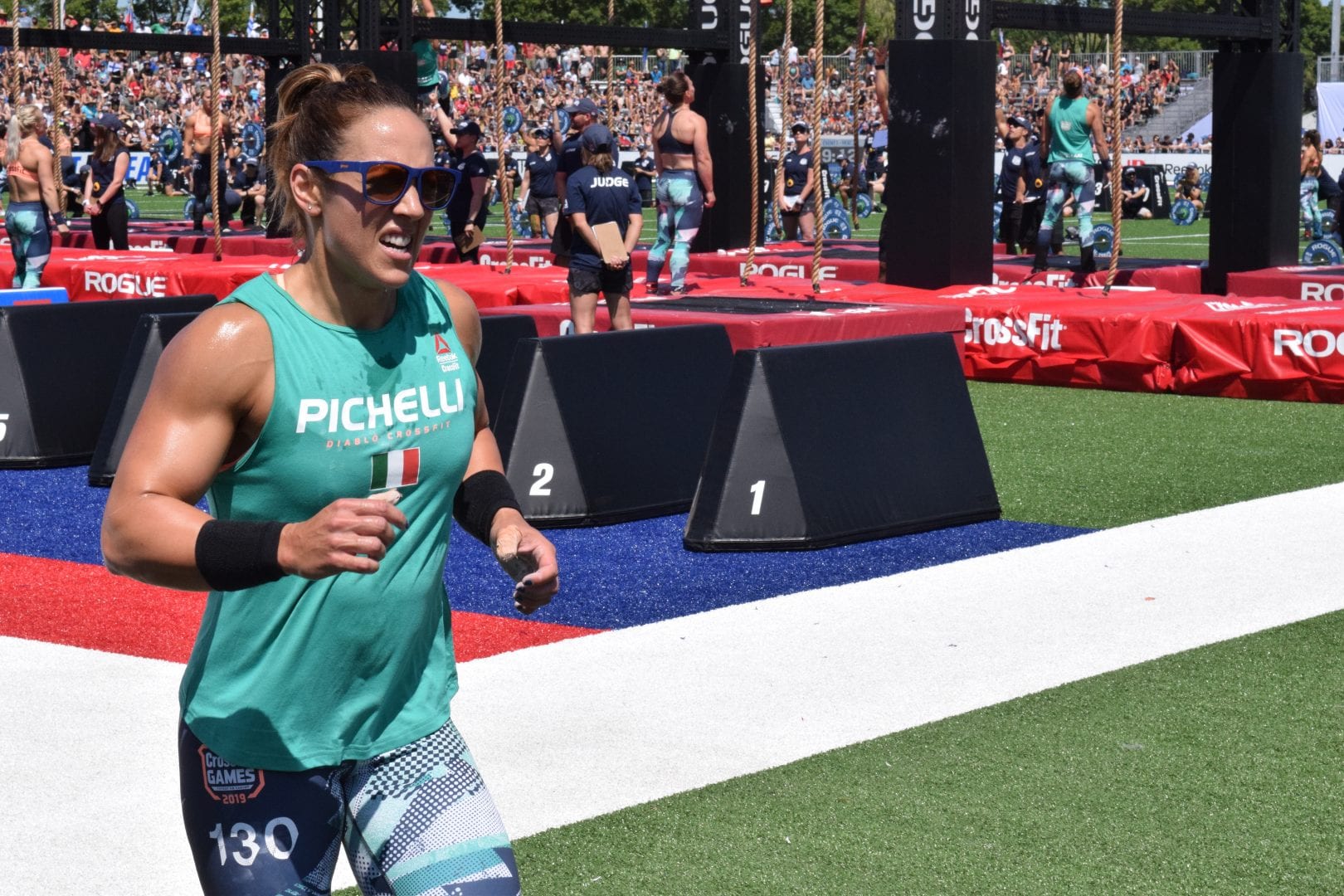Alessandra Pichelli takes a lap between rounds of legless rope climbs at the 2019 CrossFit Games