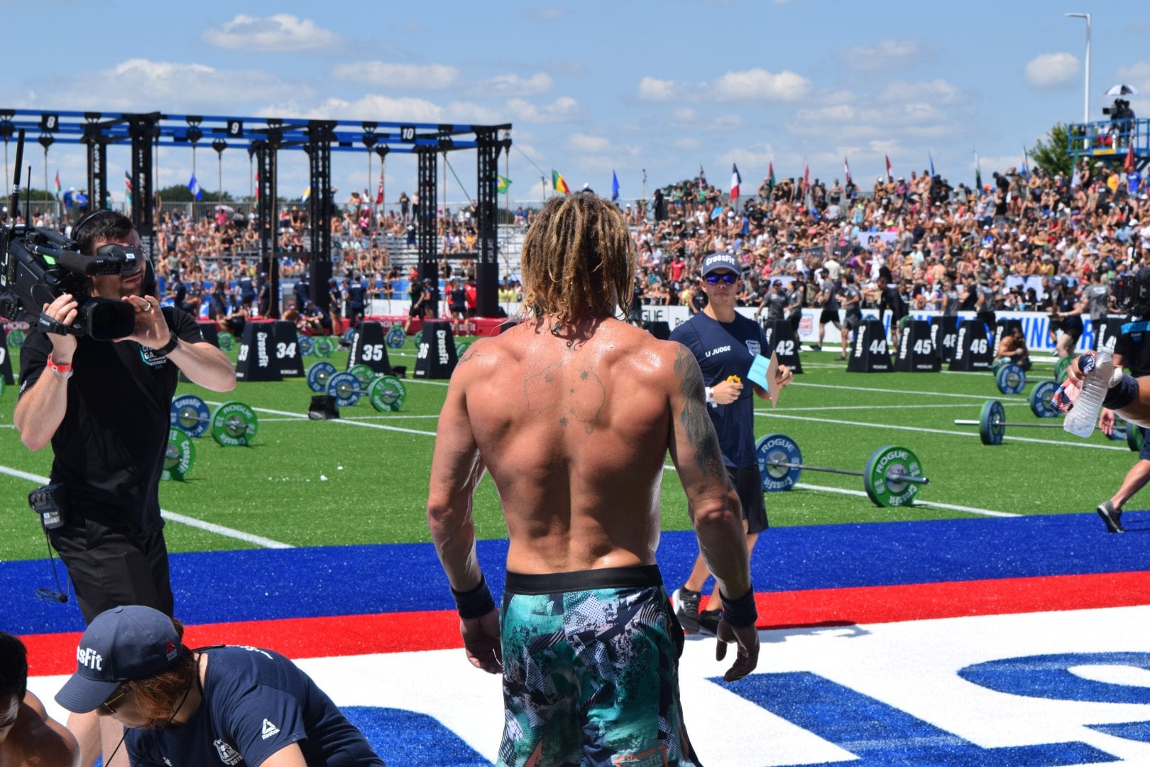 James Newbury watches other competitors finish the first event of the 2019 CrossFit Games