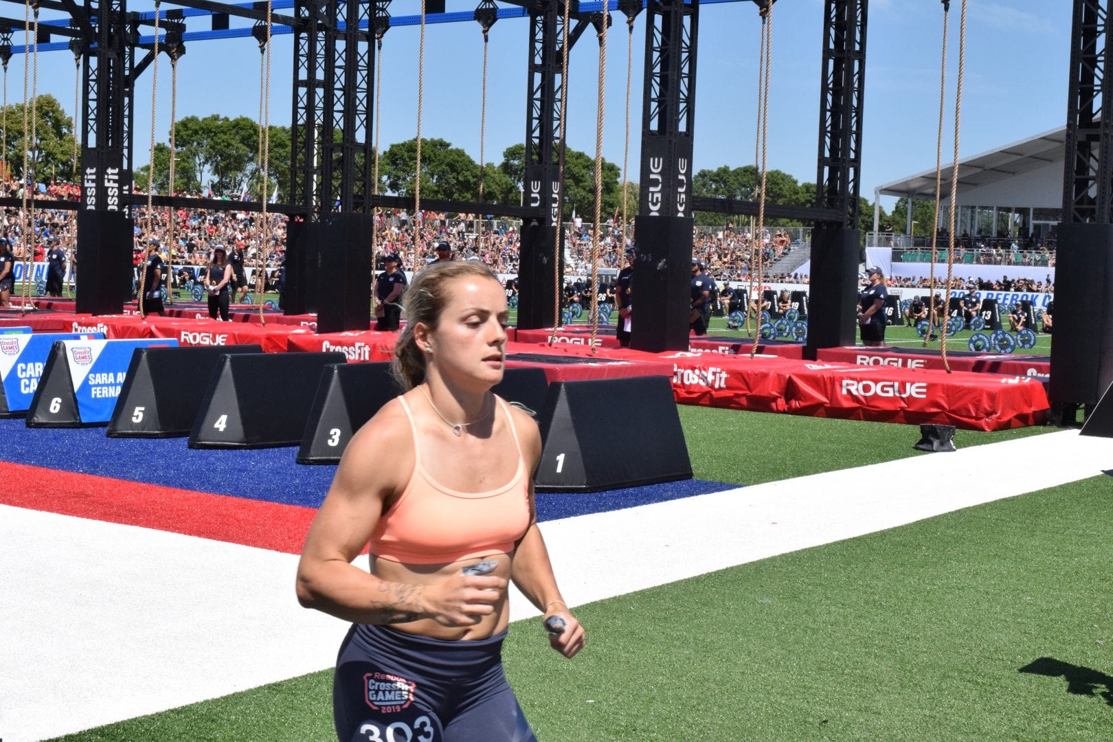 Madeline Sturt takes a lap between rounds of legless rope climbs at the 2019 CrossFit Games