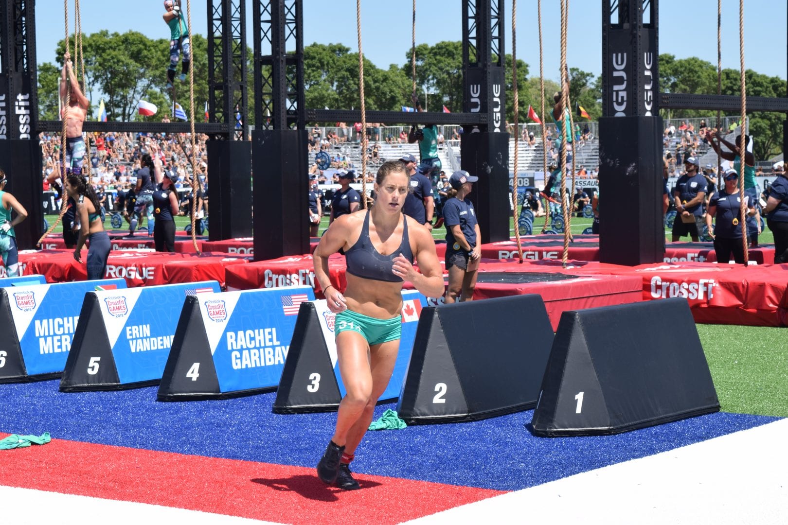 Emily Rolfe takes a lap between rounds of legless rope climbs at the 2019 CrossFit Games