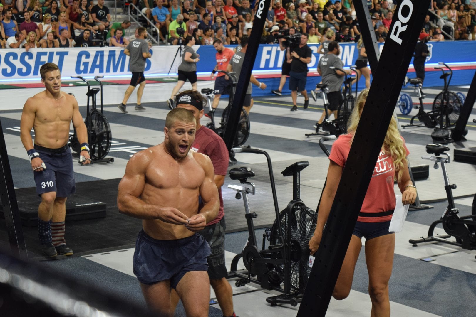 Jacob Heppner leaves the floor of the coliseum after completing an event at the 2019 CrossFit Games.