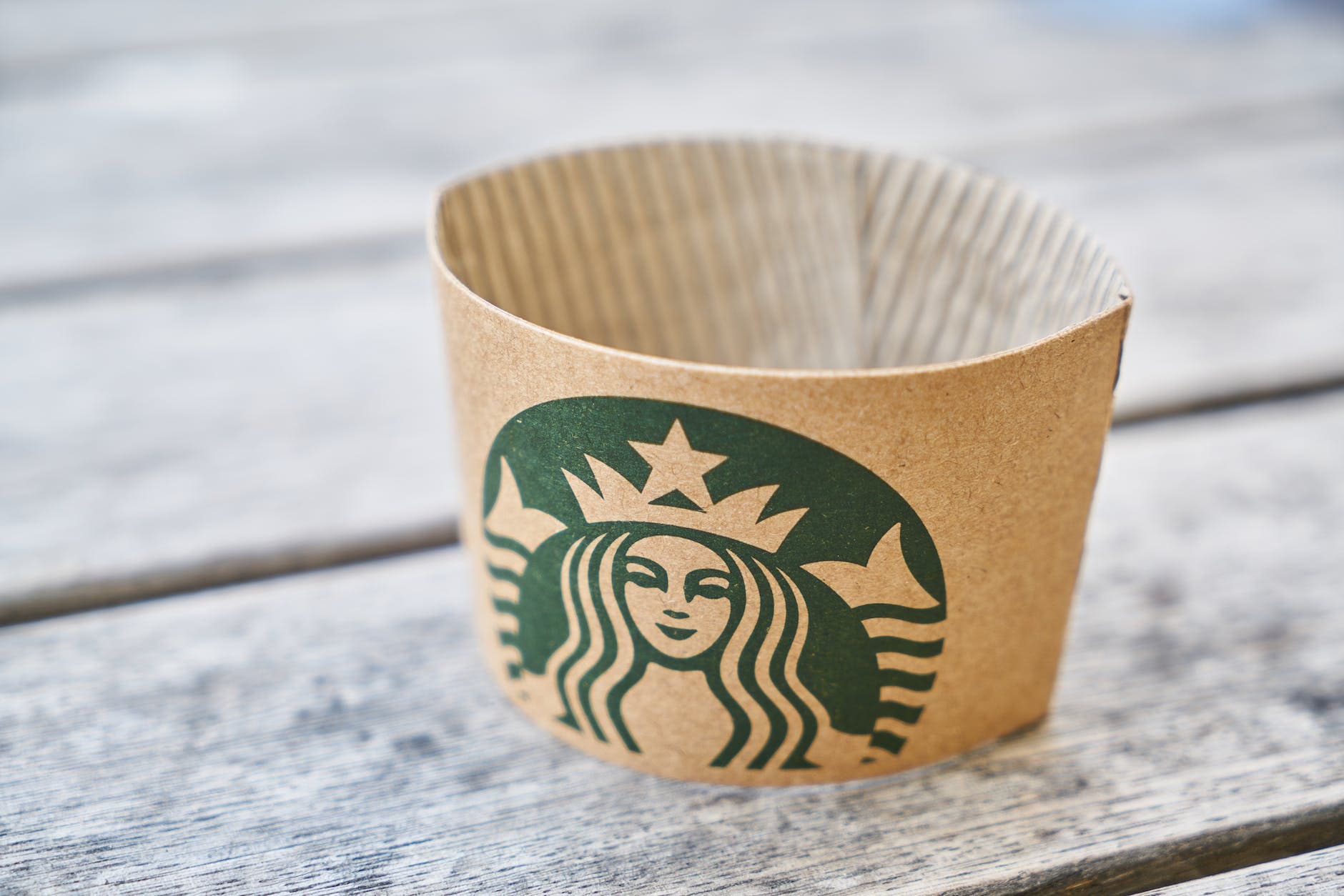 brown starbucks paper on gray wooden surface